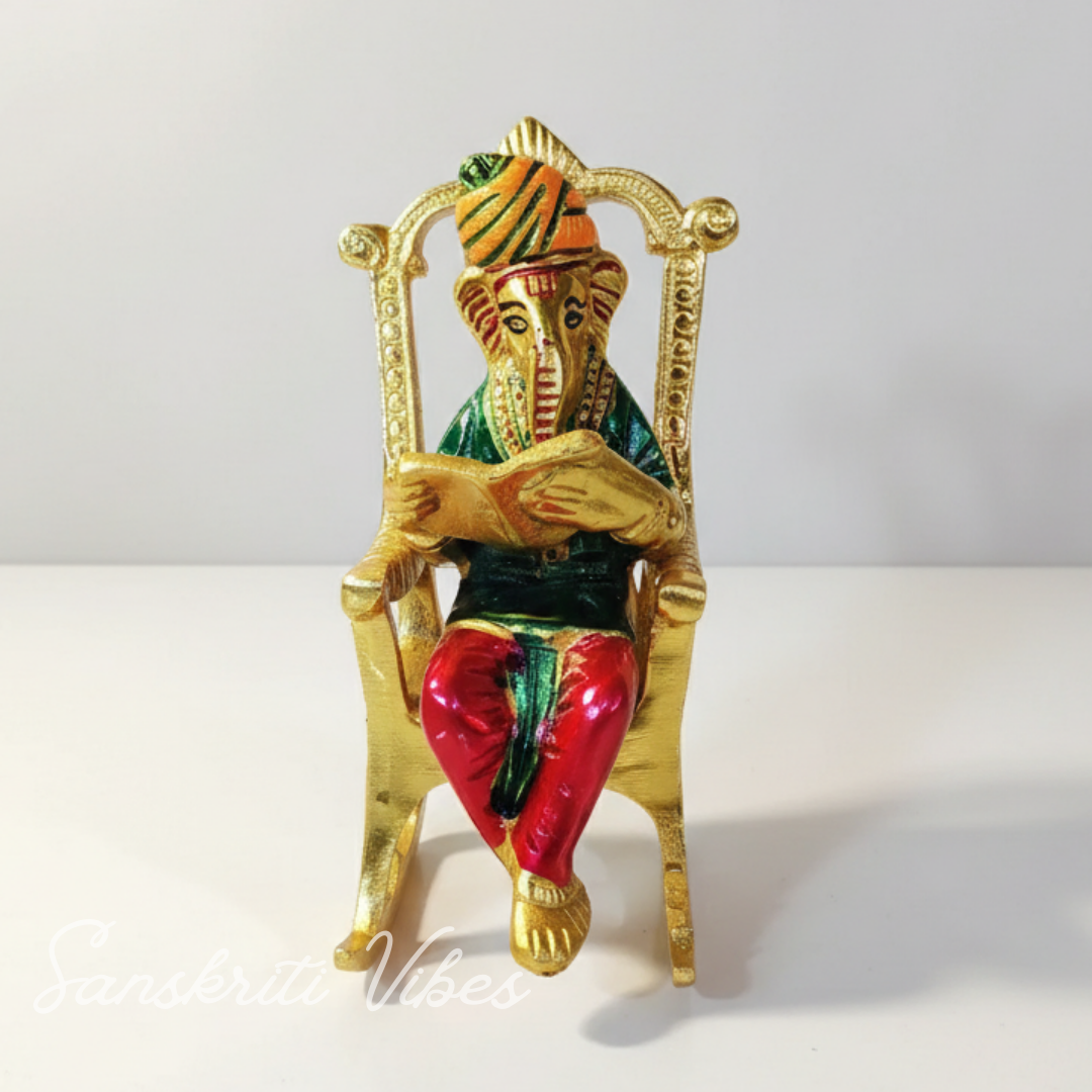 Modern Chair Ganesha Metal Statue Reading Ramayan with Meenakari Work Aluminium Ganesh Showpiece for Home Decor and Auspicious Gifting - Retail Maharaj