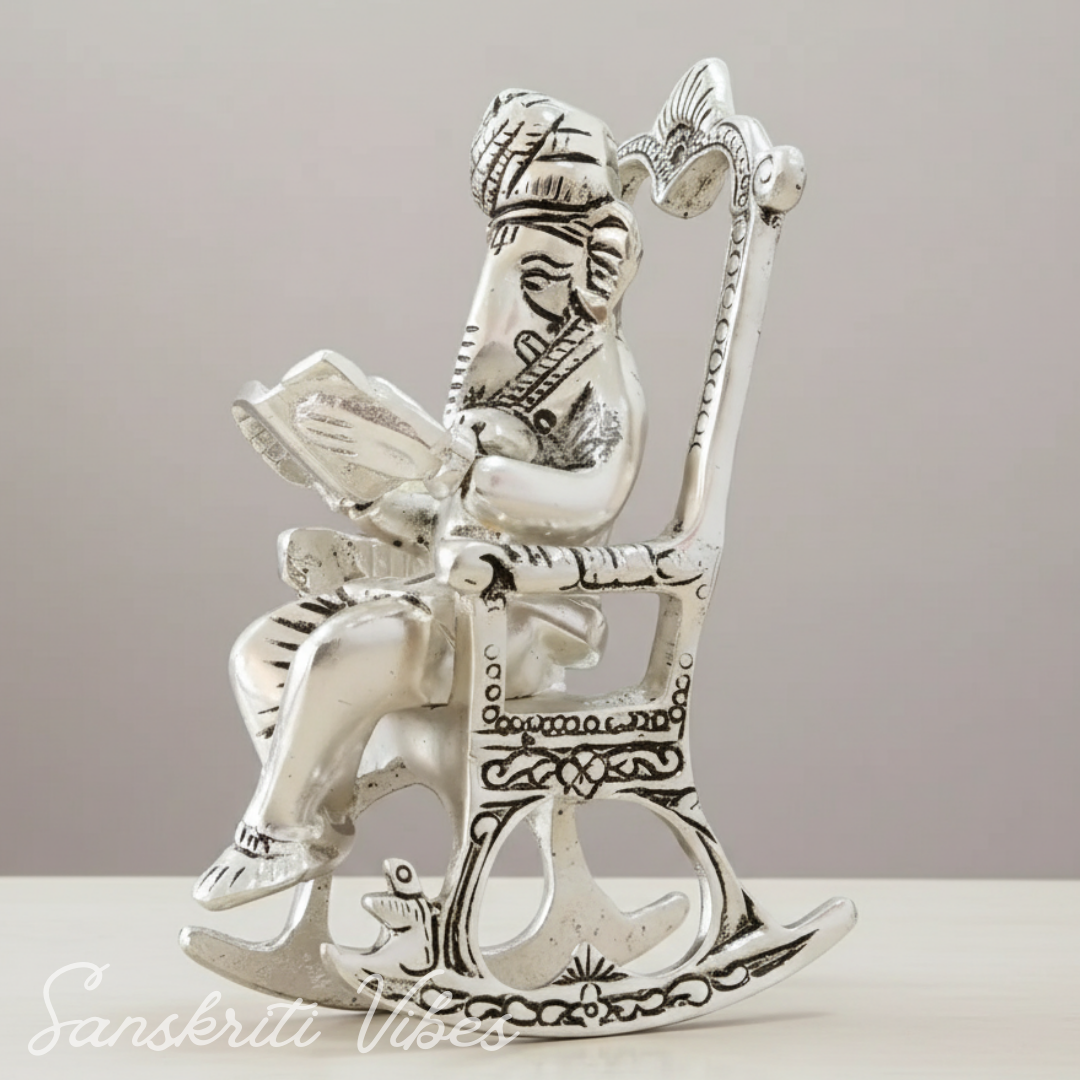 Metal Chair Ganesh Ganpati Idol with Reading Ramayan Metallic Gold Finish Traditional Indian Decorative Showpiece - Retail Maharaj