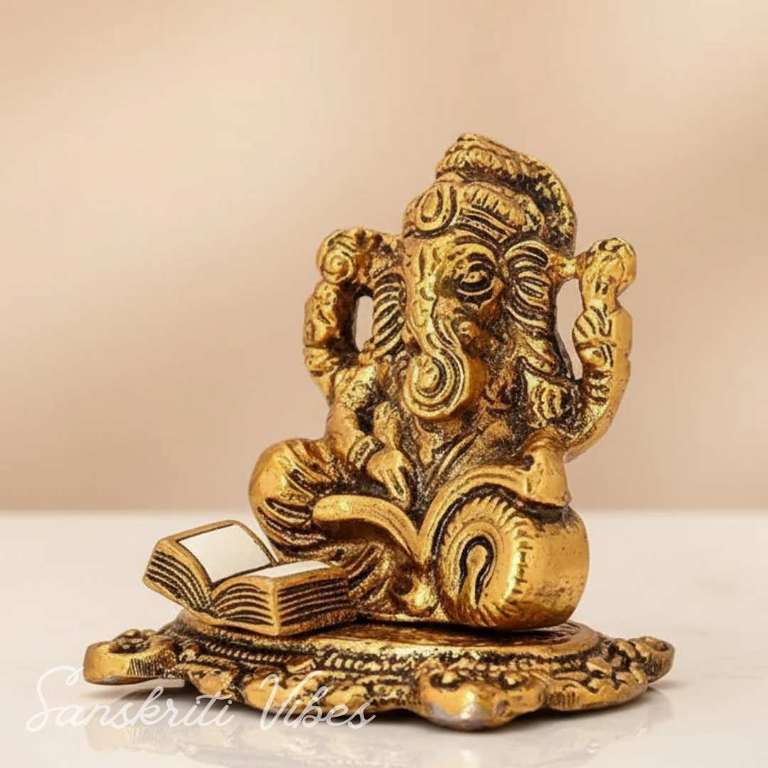 Metal Ganesh Ji Idol with Reading Book Gold Plated for Home and Office Decoration - Retail Maharaj