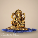 Metal Ganesh Ji Idol with Reading Book Gold Plated for Home and Office Decoration - Retail Maharaj