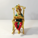 Modern Chair Ganesha Metal Statue Reading Ramayan with Meenakari Work Aluminium Ganesh Showpiece for Home Decor and Auspicious Gifting - Retail Maharaj