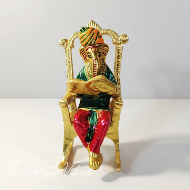 Modern Chair Ganesha Metal Statue Reading Ramayan with Meenakari Work Aluminium Ganesh Showpiece for Home Decor and Auspicious Gifting - Retail Maharaj