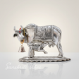 Metal Om Kamdhenu Cow and Calf Statue Decorative Showpiece for Good Luck, Vastu and Feng Shui - Retail Maharaj