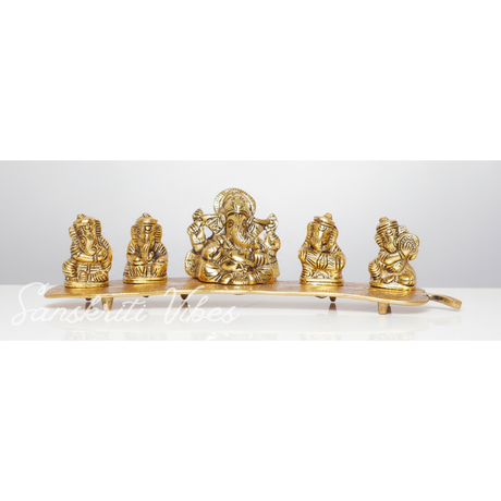 White Metal Gold Plated Ganesha On Leaf With Musical Instrument Metal Statue For Pooja Home Decor And Gift Purpose - Retail Maharaj