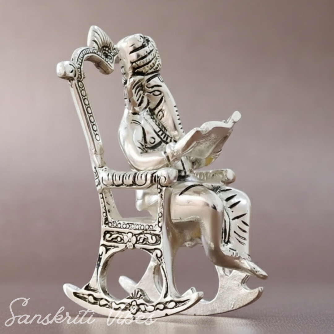 Metal Chair Ganesh Ganpati Idol with Reading Ramayan Metallic Gold Finish Traditional Indian Decorative Showpiece - Retail Maharaj