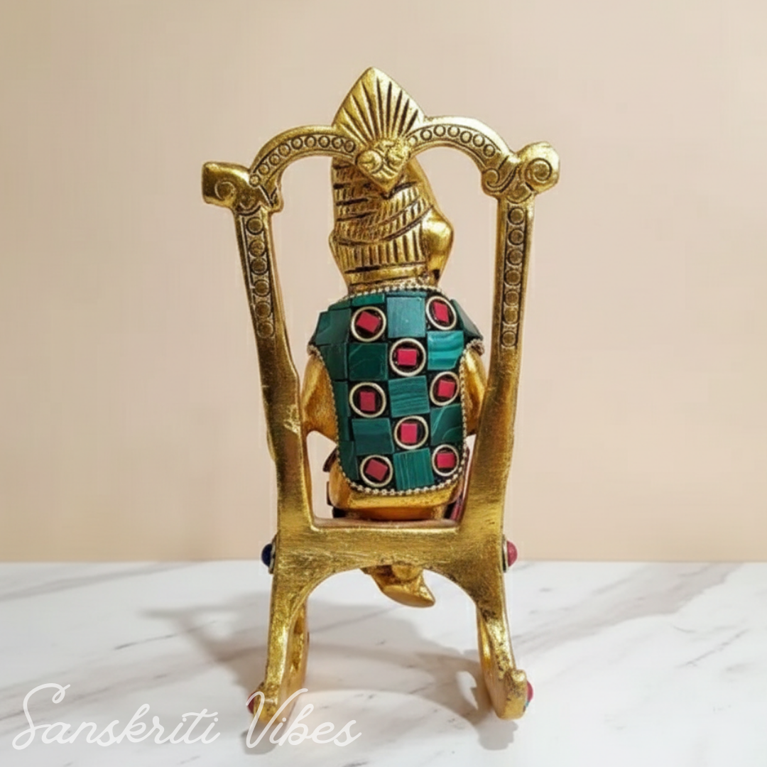 Modern Chair Ganesha Metal Statue Reading Ramayan with Stone Work Showpiece for Home Glossy Finish Ganpati Idol - Retail Maharaj