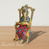 Modern Chair Ganesha Metal Statue Reading Ramayan with Stone Work Showpiece for Home Glossy Finish Ganpati Idol - Retail Maharaj