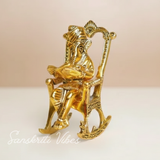 Metal Ganesha Sitting on Moving Chair Reading Ramayan – Handcrafted Ganpati Decorative Statue for Home & Office (Glossy Finish, Made in India)