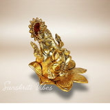 Metal Ganesh Sitting On Flower Gold Color Leaf For Pooja - Retail Maharaj