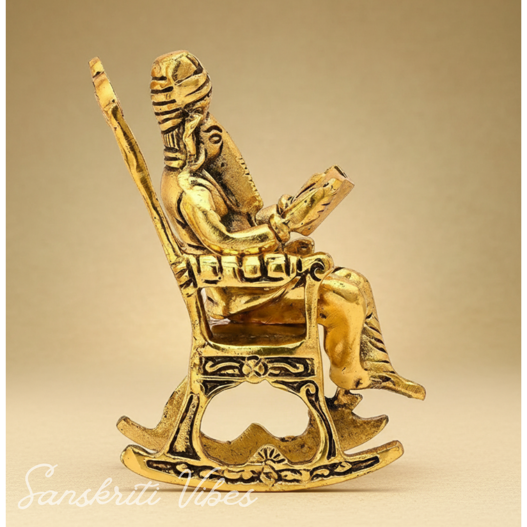 Metal Ganesha Sitting on Moving Chair Reading Ramayan – Handcrafted Ganpati Decorative Statue for Home & Office (Glossy Finish, Made in India)